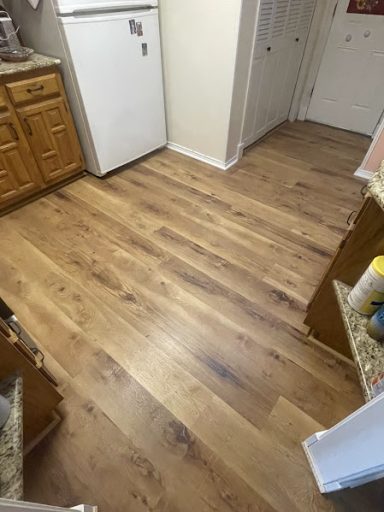 New laminate flooring installation in living room of San Angelo TX home. 