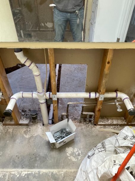 Exposed plumbing during a repair/repipe.